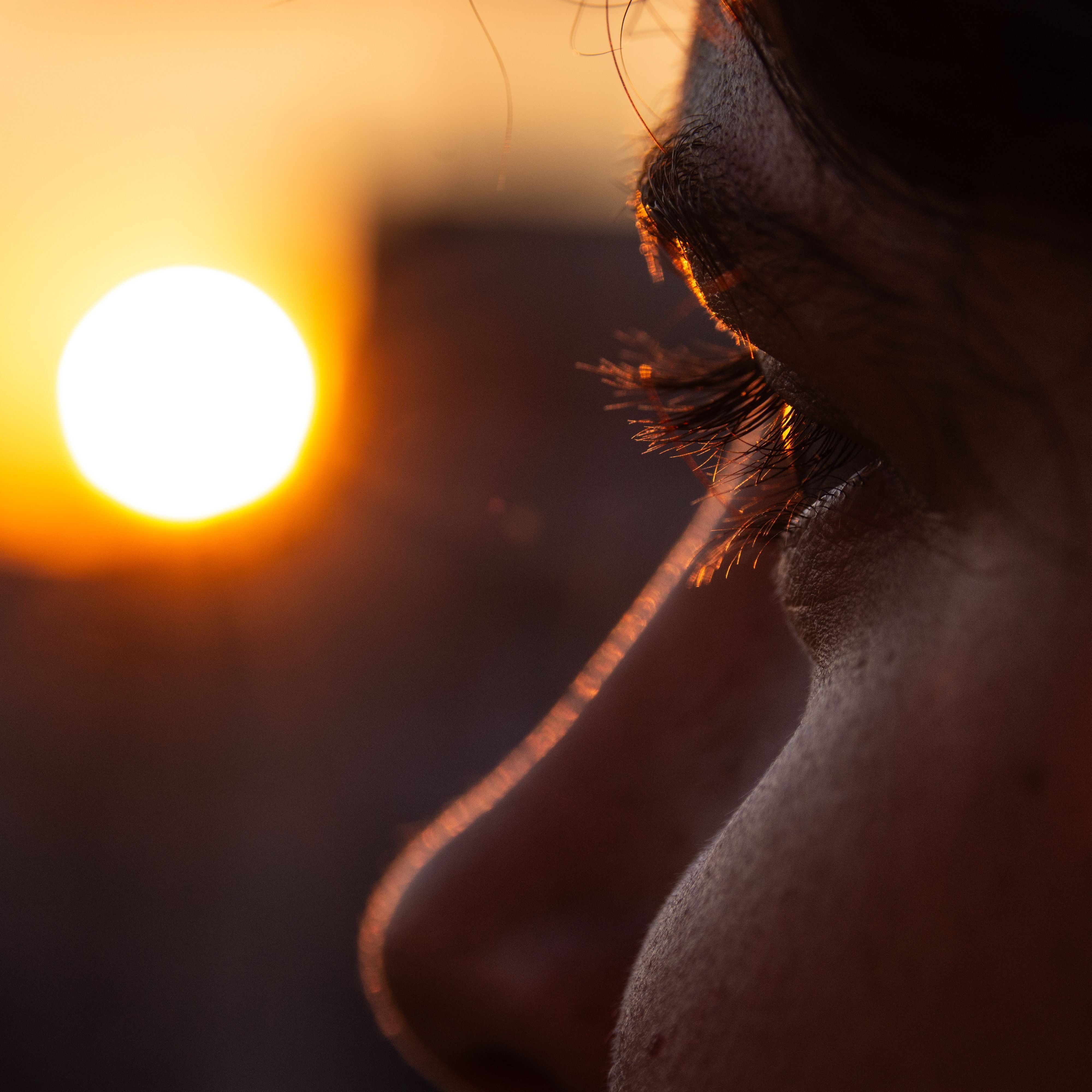 Close up of eye and sunrise