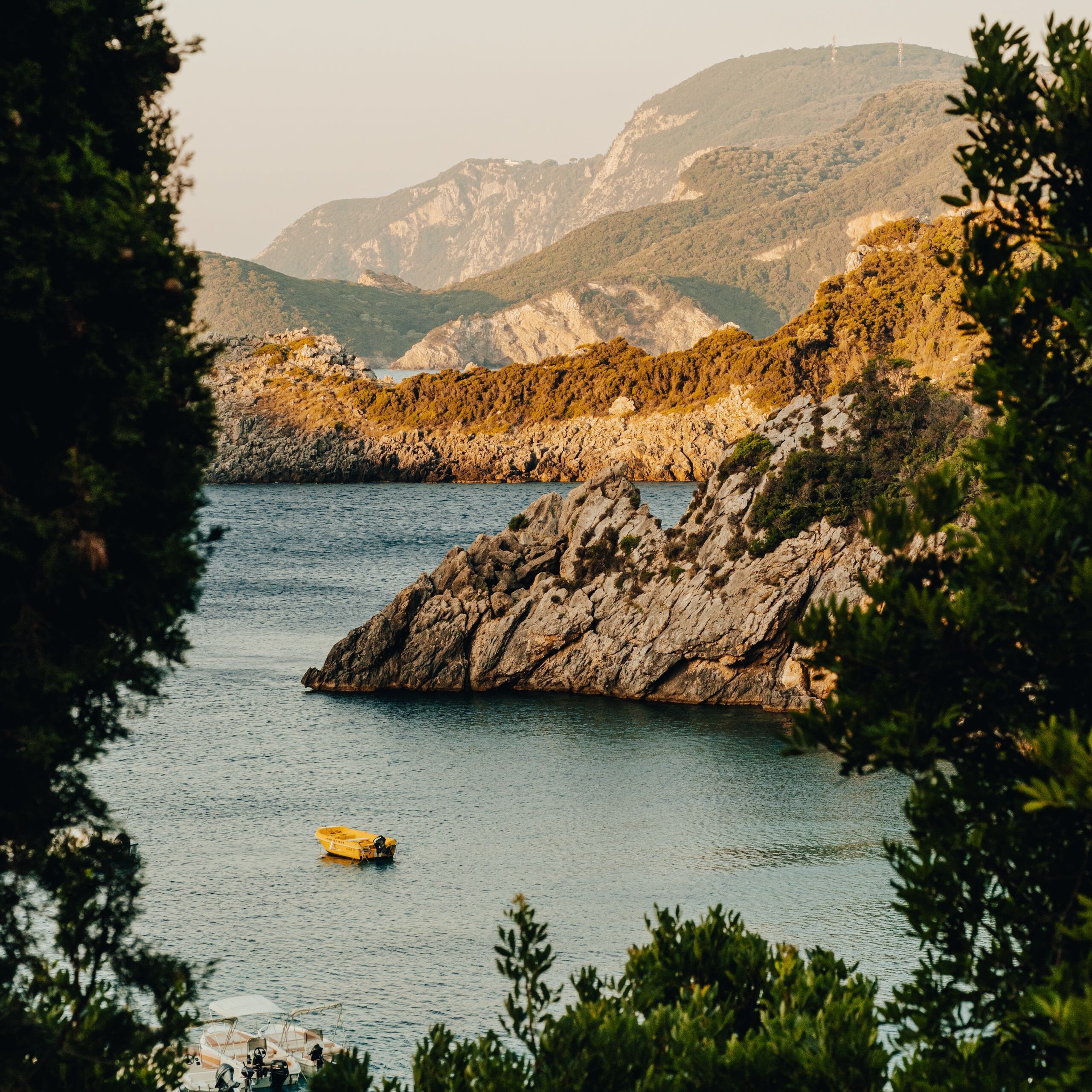 Sunrise mountains sea boat